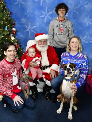 Mike and his family with Santa Claus