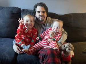 Mike with Ryan, Owen and Emily in festive Christmas attire.